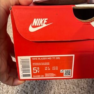 Nike Blazer Mid '77 GS in White, Black, and Orange